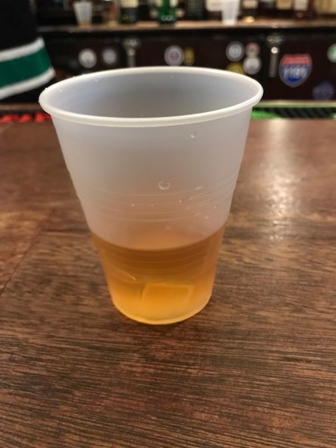 Tullamore Dew in a plastic cup at Nancy Whiskey