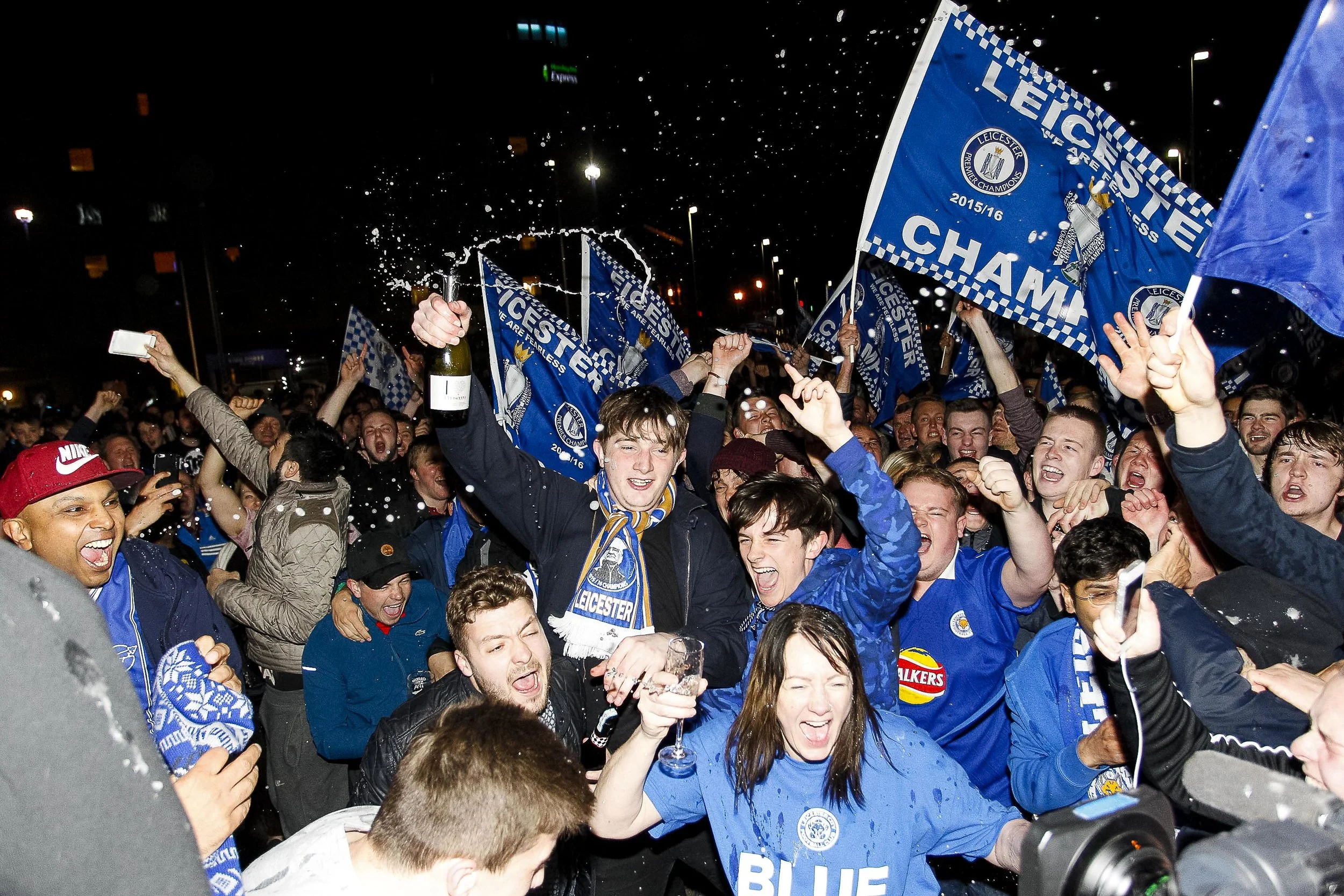 Leicester City fans celebrate their team's place at the top of the Premiership outside the King Power Stadium, Leicester City were 5,000-to-1 odds on winning the 2015/2016 season.
