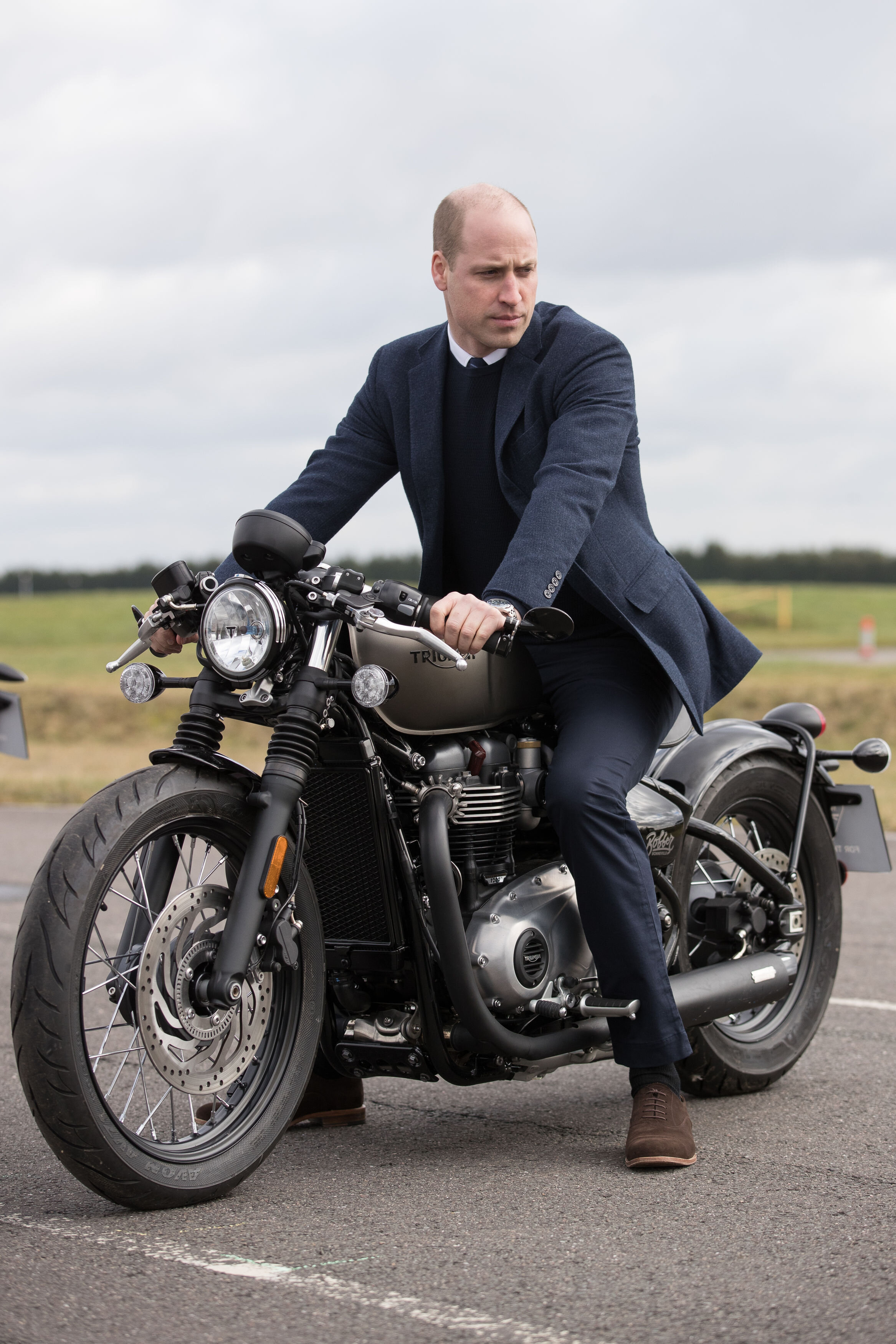  The Duke of Cambridge sits upon a Triumph Bobber motorcycle during a visit to the MIRA Technology Park in Nuneaton, Warwickshire, which supplies pioneering engineering, research and test services to the transport industry. MIRA was formerly known as