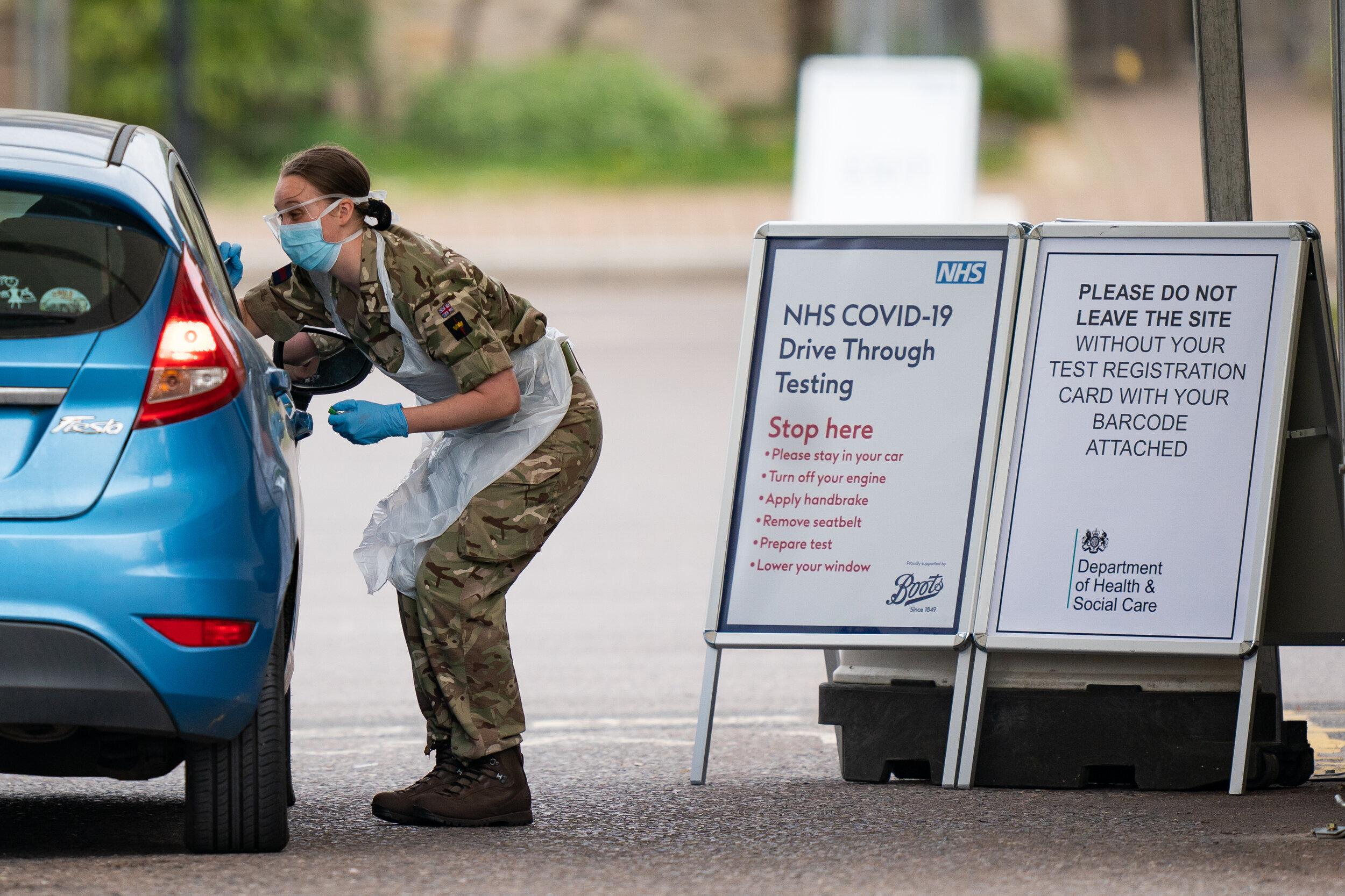  A NHS worker being tested for coronavirus by a member of the military at a temporary testing station in the car park of Chessington World of Adventures in Chessington, Greater London. Picture by: Aaron Chown/PA Images 