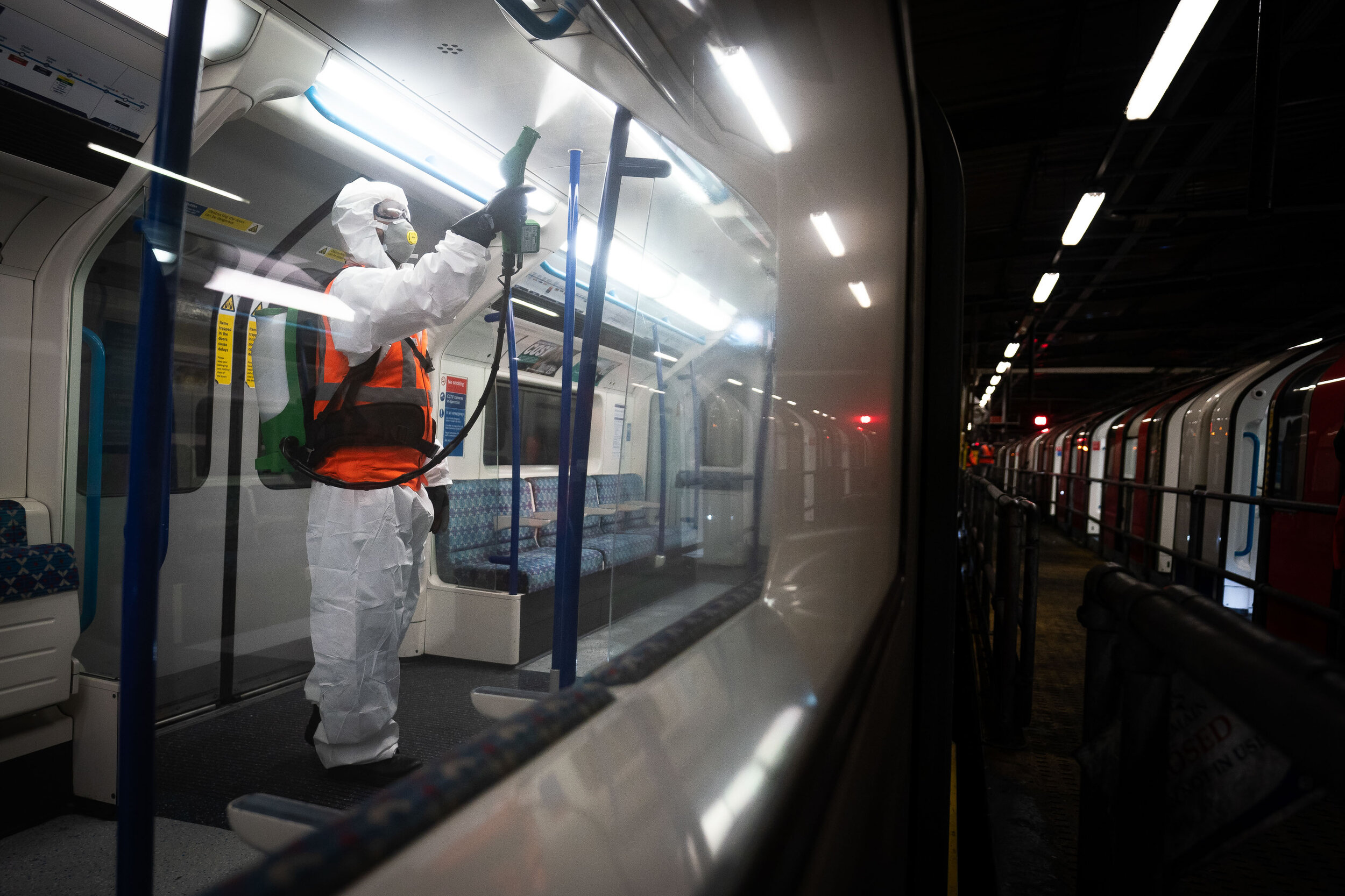  A night shift with Noureddine Aouf, a TFL worker, as he deep cleans and sprays the Victoria Line tube trains with an antiviral solution at a Underground Depot in North London. Zoono-17 is a microbe shield surface sanitiser, which is 99.99% effective