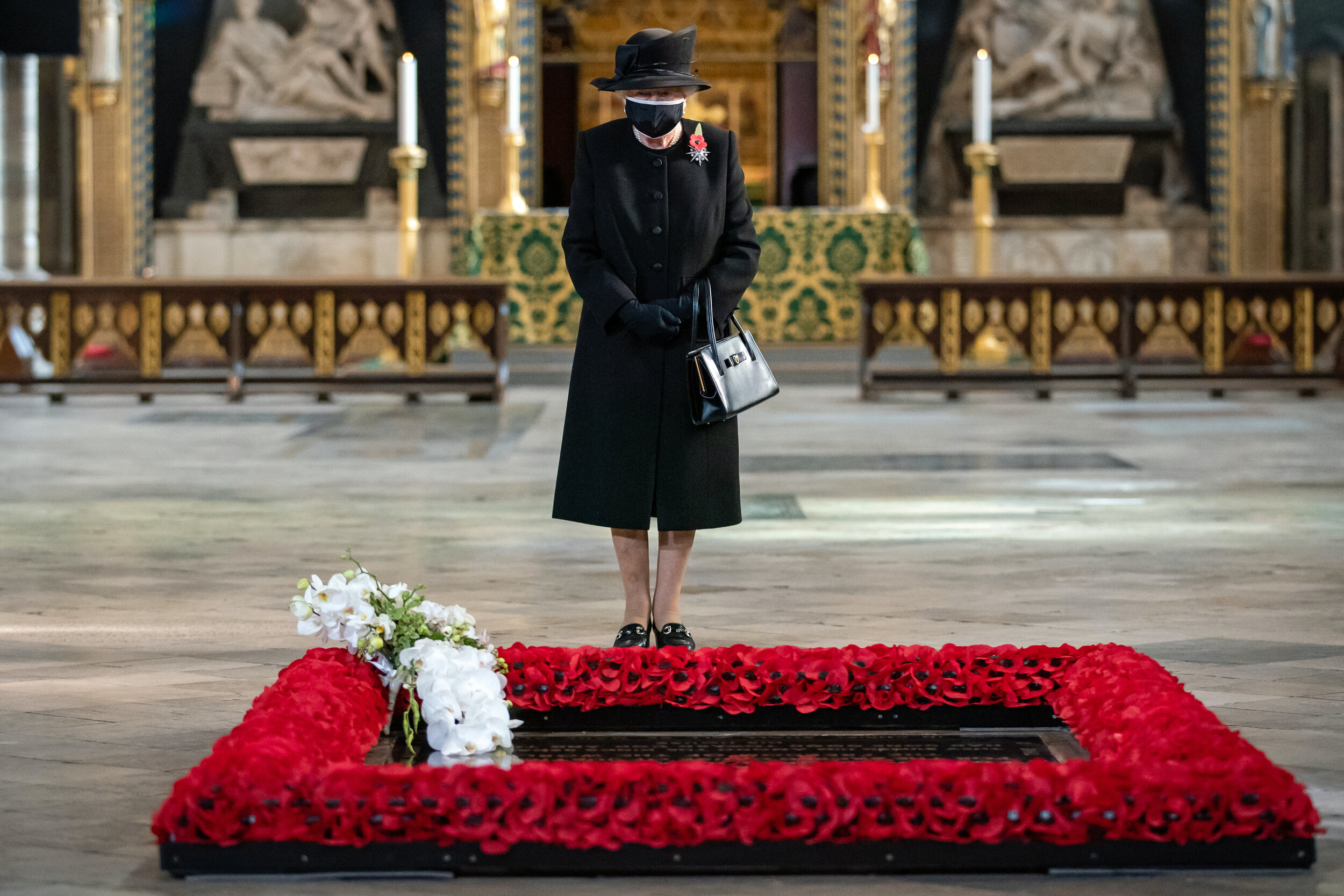  Queen Elizabeth II during a ceremony in London's Westminster Abbey to mark the centenary of the burial of the Unknown Warrior. A range of face masks has been unveiled as part of the Royal Collection's Christmas gifts collection. Date taken: 11-Nov-2