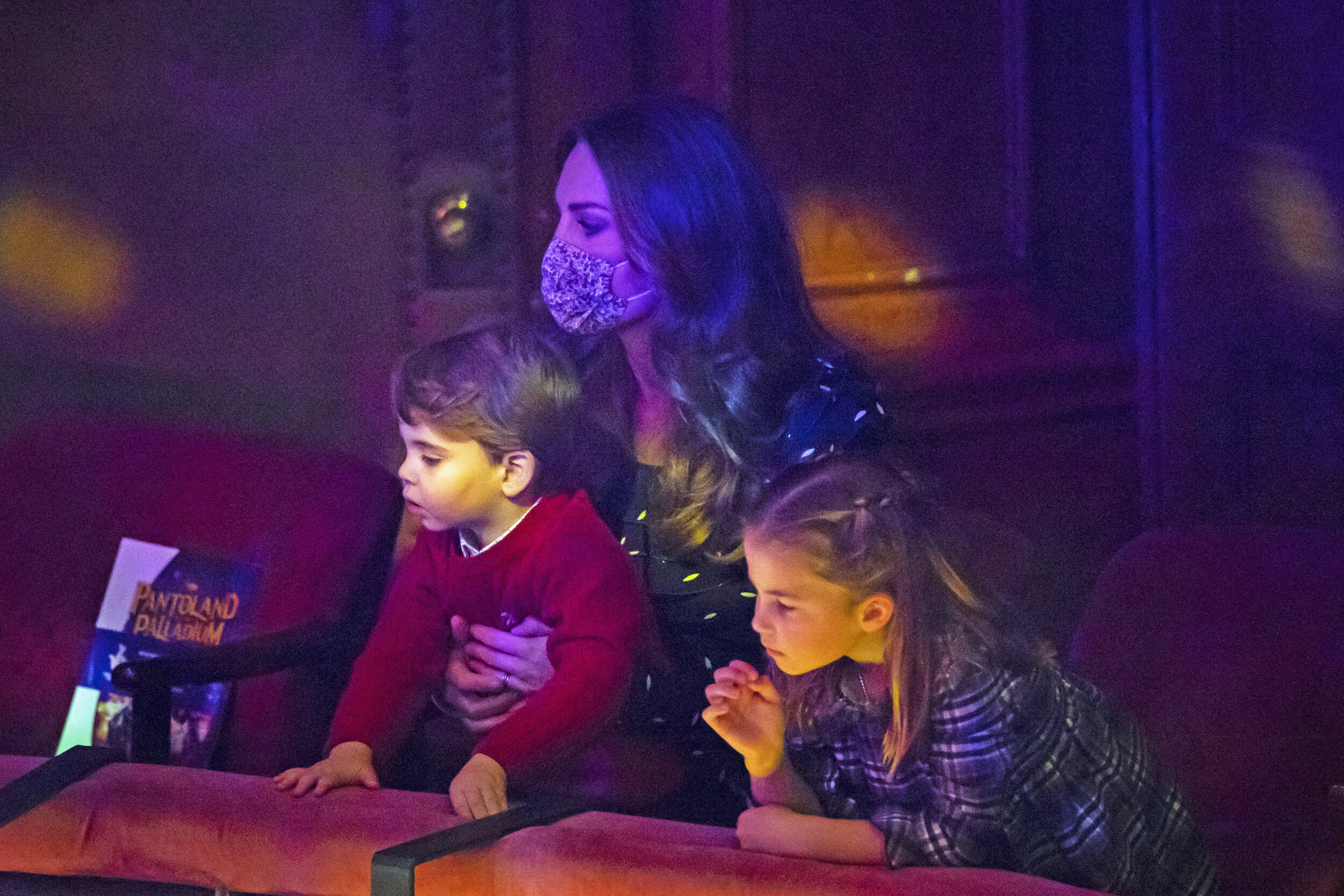  The Duchess of Cambridge with Prince Louis and Princess Charlotte attending a special pantomime performance at London's Palladium Theatre, hosted by The National Lottery, to thank key workers and their families for their efforts throughout the pande