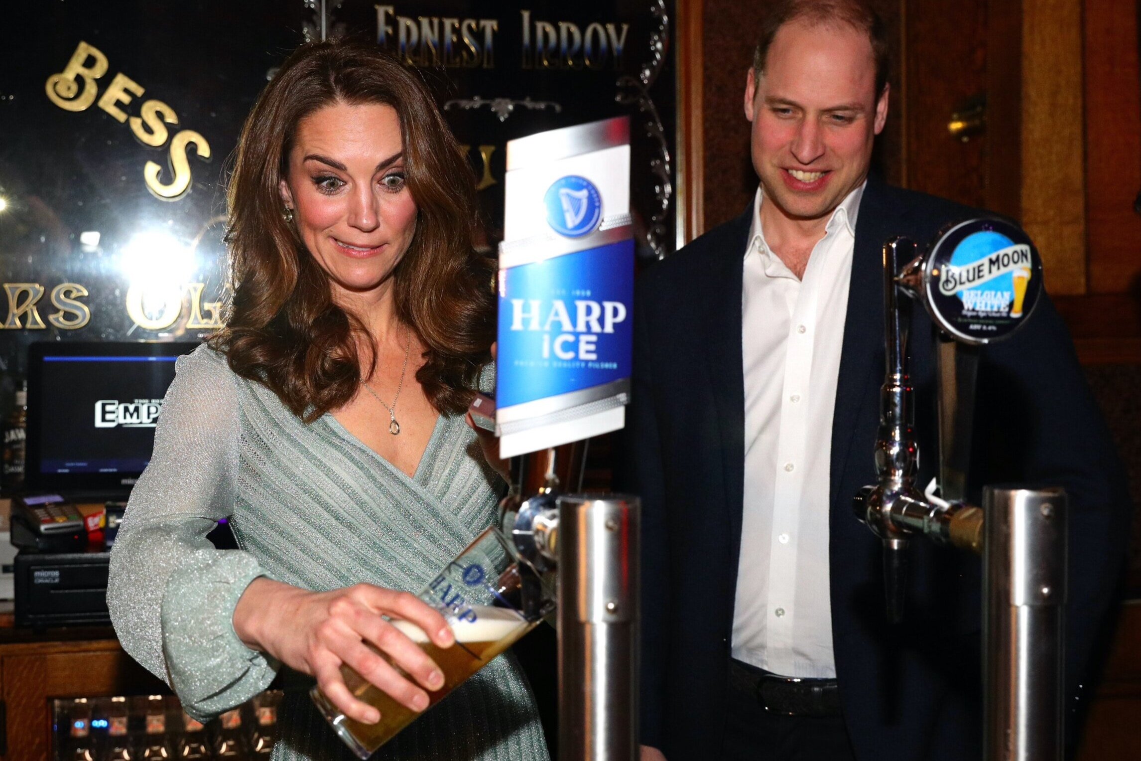  The Duchess of Cambridge pulls a pint with the Duke of Cambridge during their visit to Belfast Empire Hall for an informal party to celebrate inspirational young people who are making a real difference in Northern Ireland as part of their two day vi