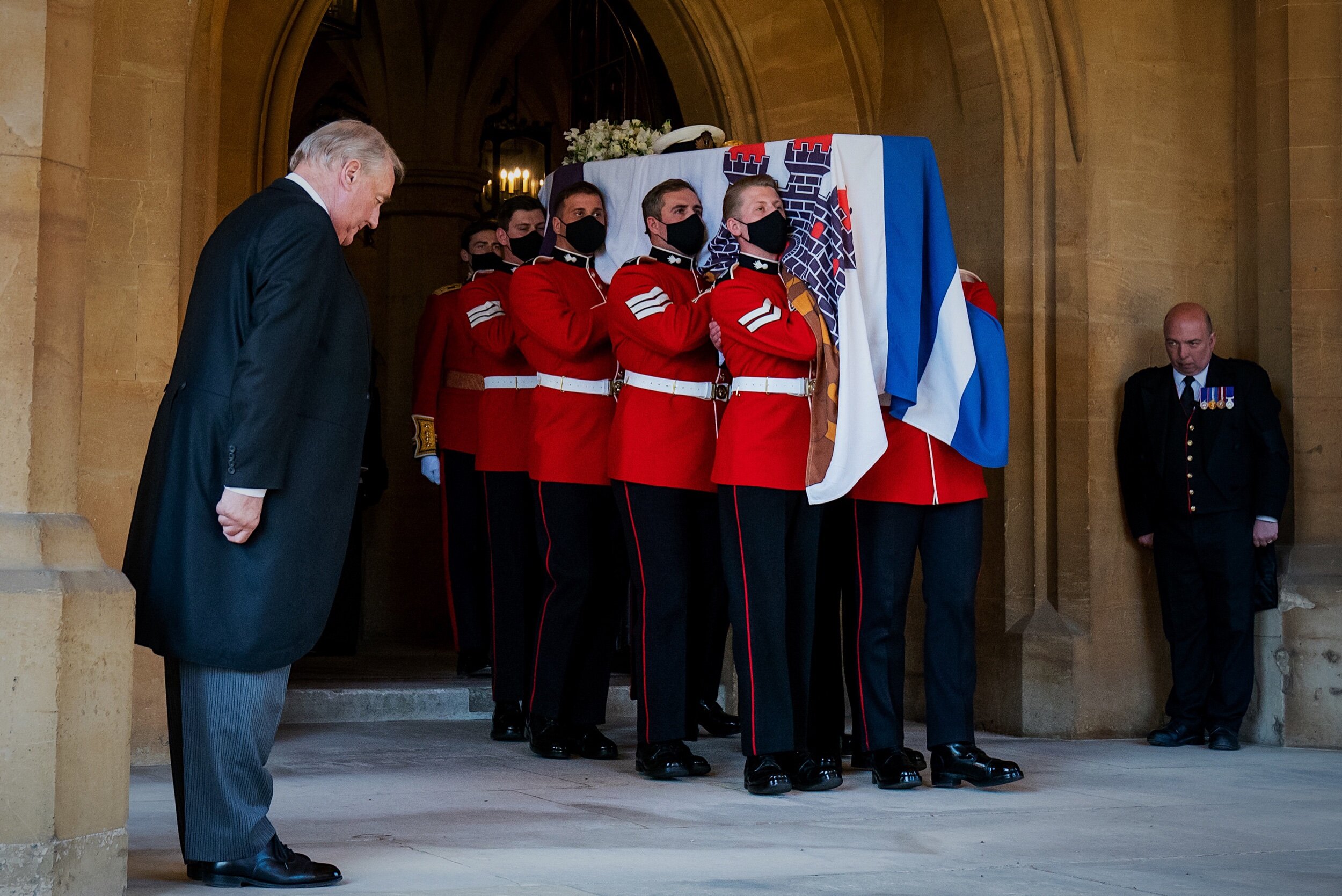   The Duke of Edinburgh's coffin, covered with his Personal Standard, is carried to the purpose built Land Rover Defender ahead of the funeral of the Duke of Edinburgh in Windsor Castle, Berkshire. Picture date: Saturday April 17, 2021.  
