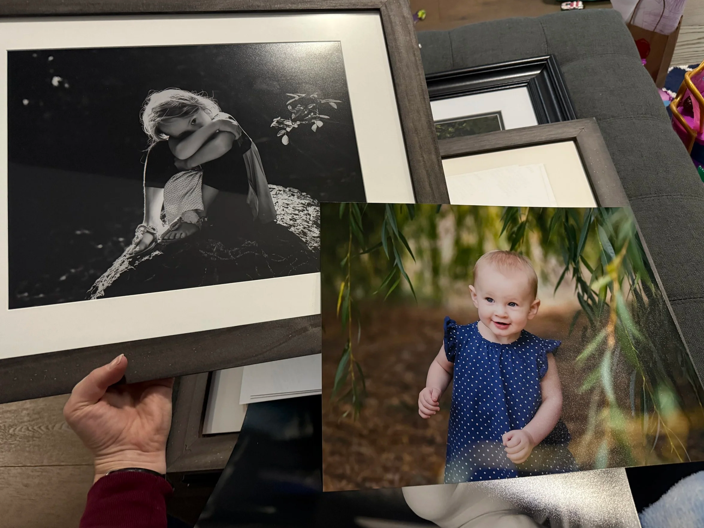 two images next to each other. one of a one year old looking curious and the other of the same child as a 5 yaer old with a moody backlit look while she snuggles her stuffed animal.