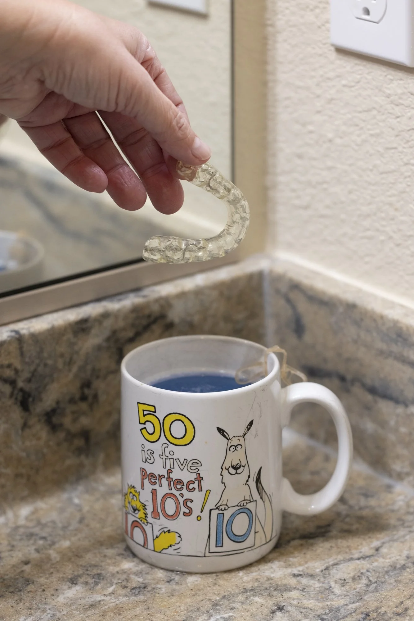 My Mouthguard in Dad's Mug