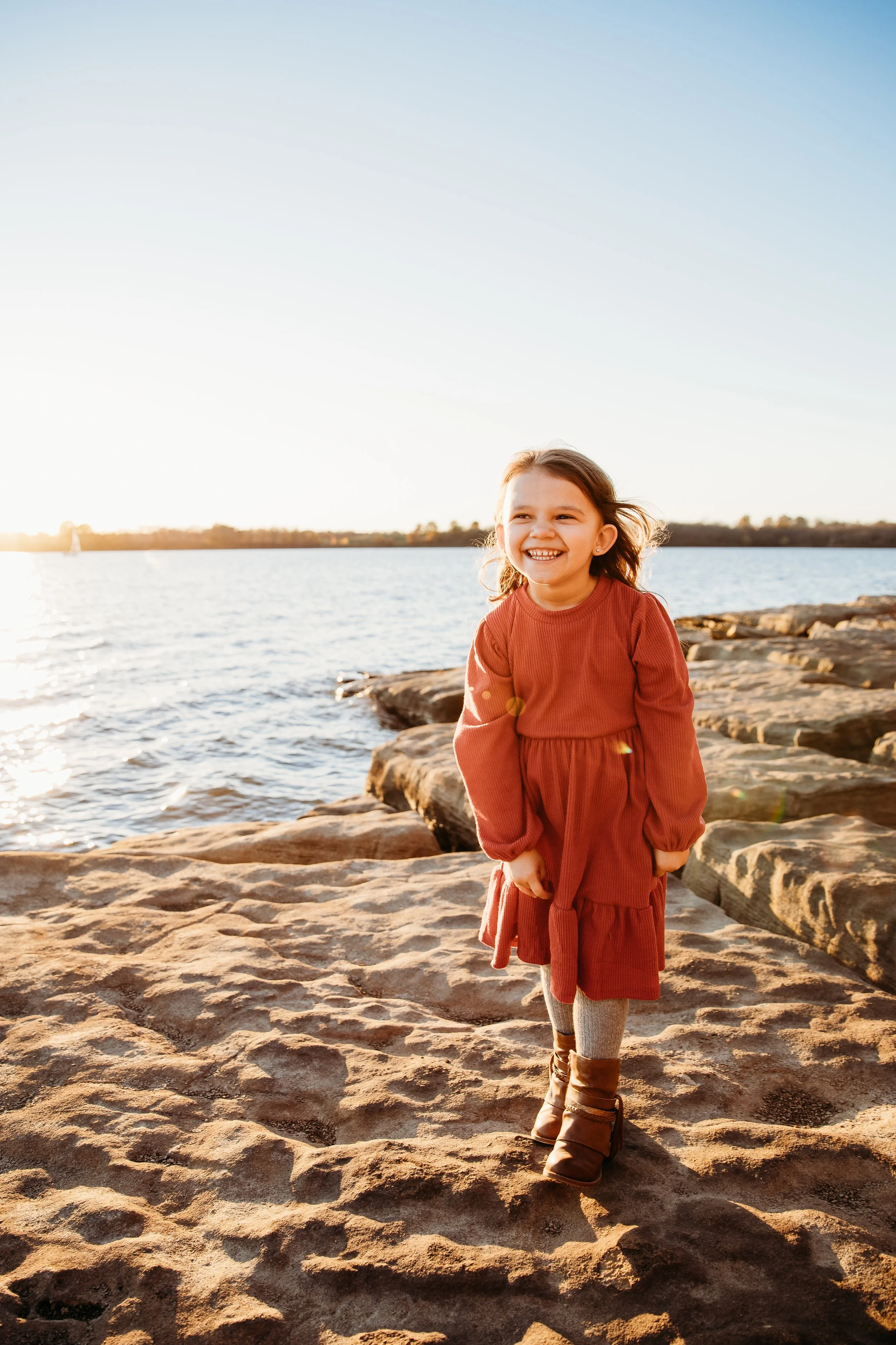 Girl at family photo session next to Smithville Lake