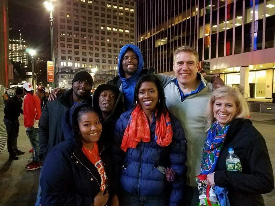 Florida Gators men’s basketball center Kevarrius Hayes takes a photo with his family — his biological family and the Ulmers — outside of Madison Square Garden in New York, New York.