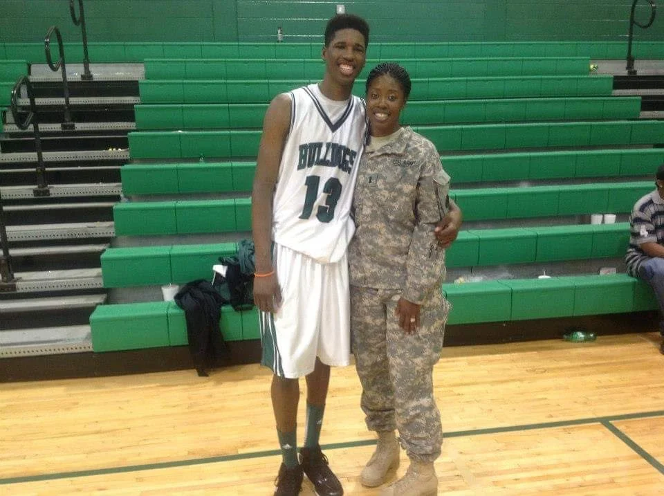 Kevarrius Hayes takes a picture with his mother, Army Captain Verrice Hayes, in high school.