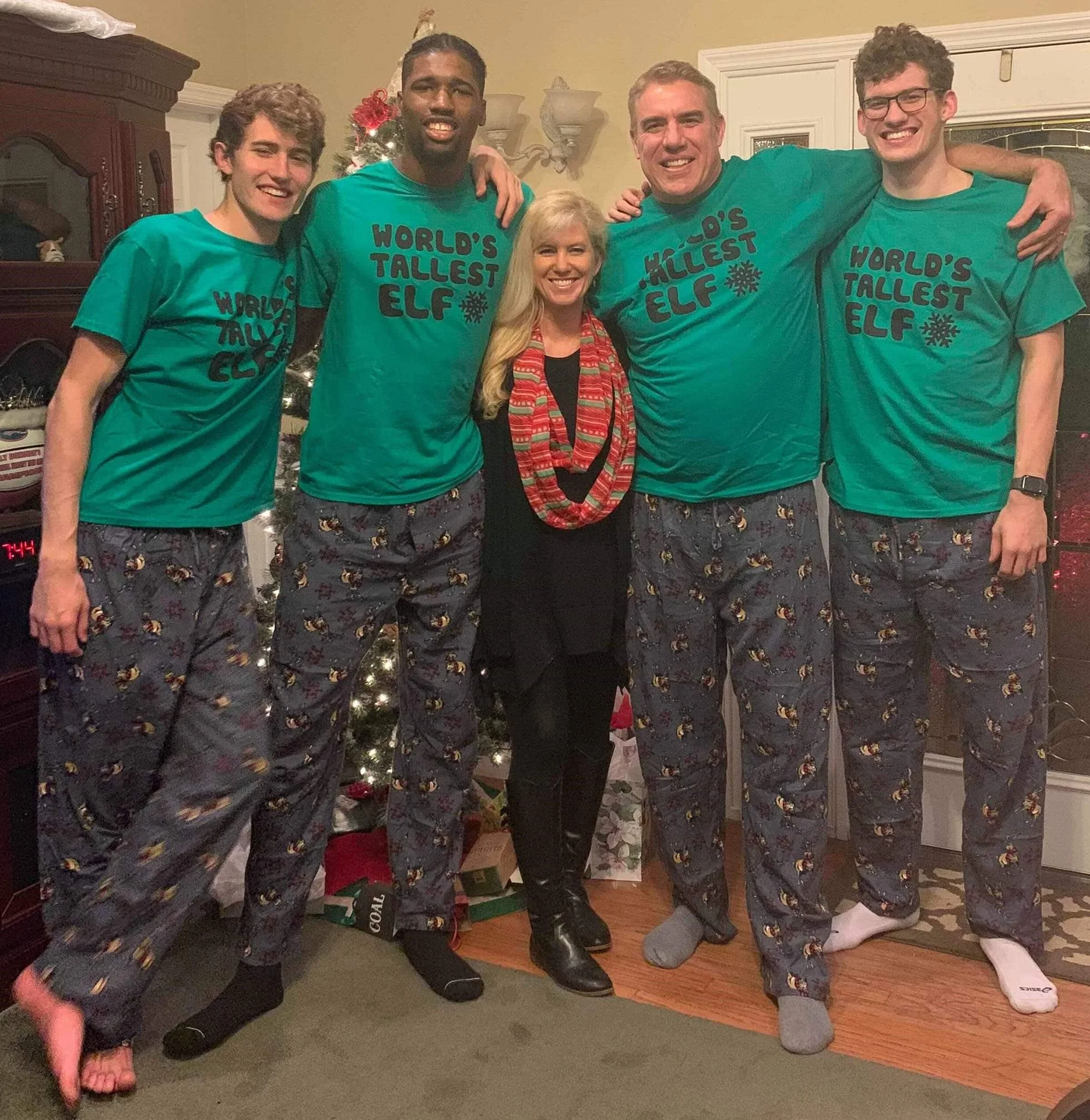 The Ulmers and Hayes take their annual Christmas picture in pajamas. A family of athletes, the men rocked “World’s Tallest Elf” shirts.