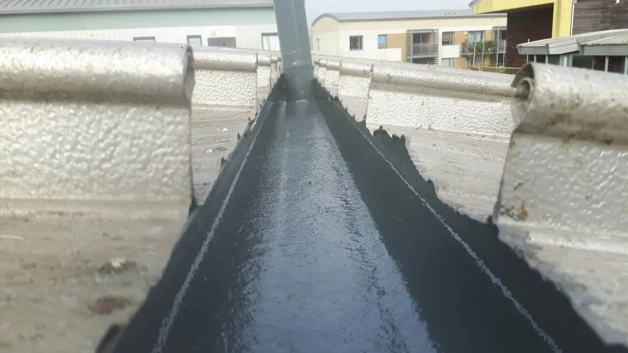 Commercial box gutter lined with a liquid waterproofing system