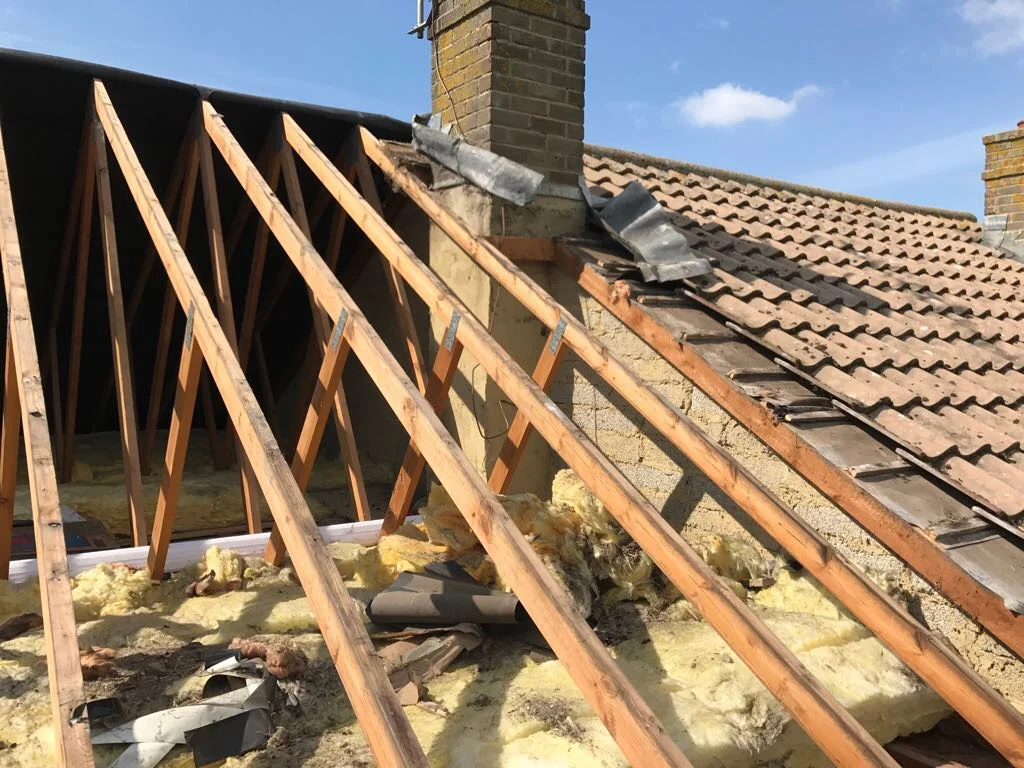 Roof covering removed to expose rafters during a Bespoke roof lining replacement