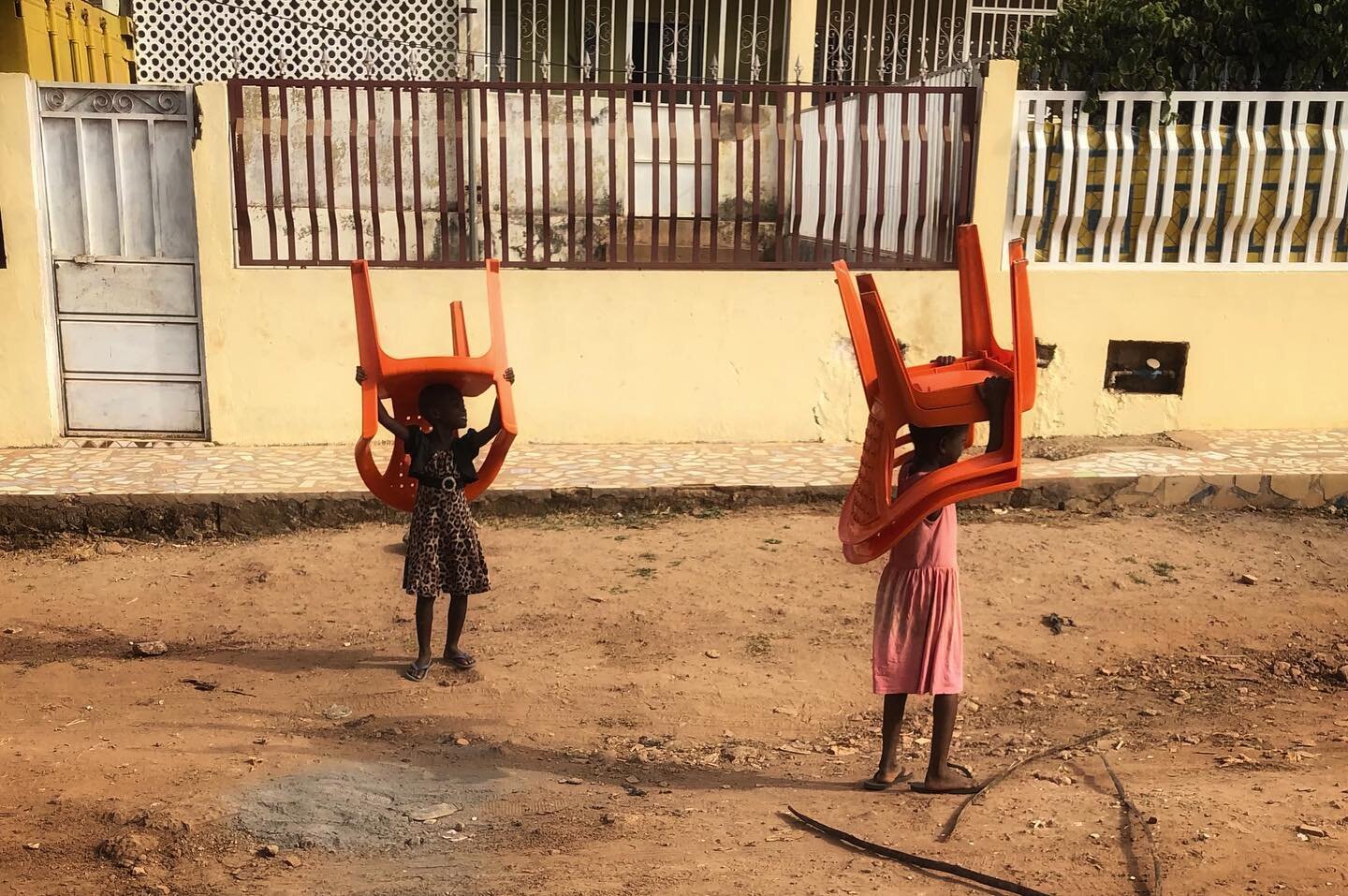 Chairs on their way to church early Sunday morning #streetsofbissau