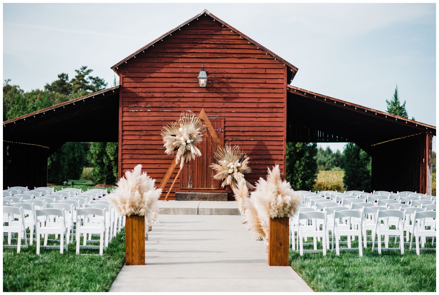 The Barns of Kanak wedding venue ceremony in front of barn