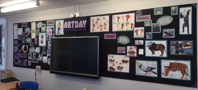 This was a display of a whole school Art day. Each year group studied a different form of art such as printing, painting, modelling, collage, sketching and photography.
