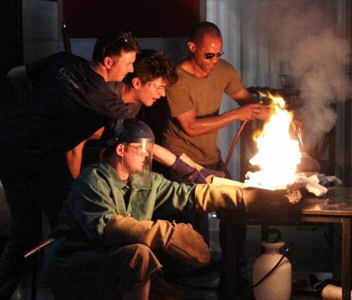 Interns and the Starworks Glass team work with Ché Rhodes for a Firefest glassblowing demonstration