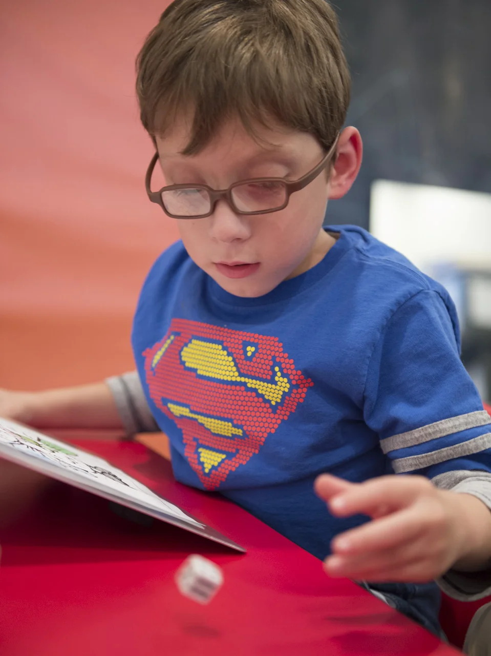  Josiah throws a dice to decide which object he is allowed to color while he is in therapy in Charleston. W.Va. Learning how to count on the spot and make decisions based on that is very important for his developmental learning. 