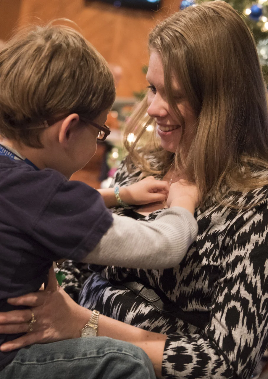  After a trip to the store Crystal comforts Josiah during lunch at Fat Pattys in Teays Valley, W.Va. His brace at times hurts his back. 