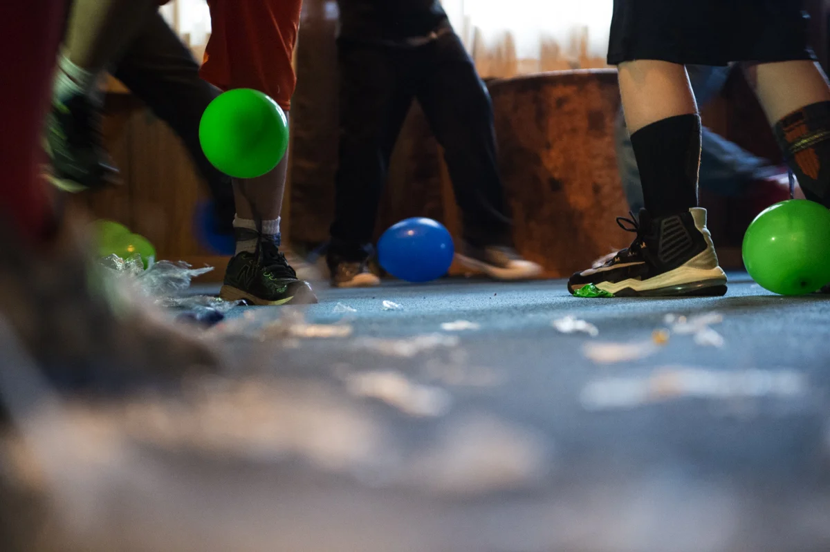 Kids kick balloons at Colin Shafer’s birthday party in Trimble, Ohio. For them, inside games are as much fun as outside ones and are a welcome break from game systems.