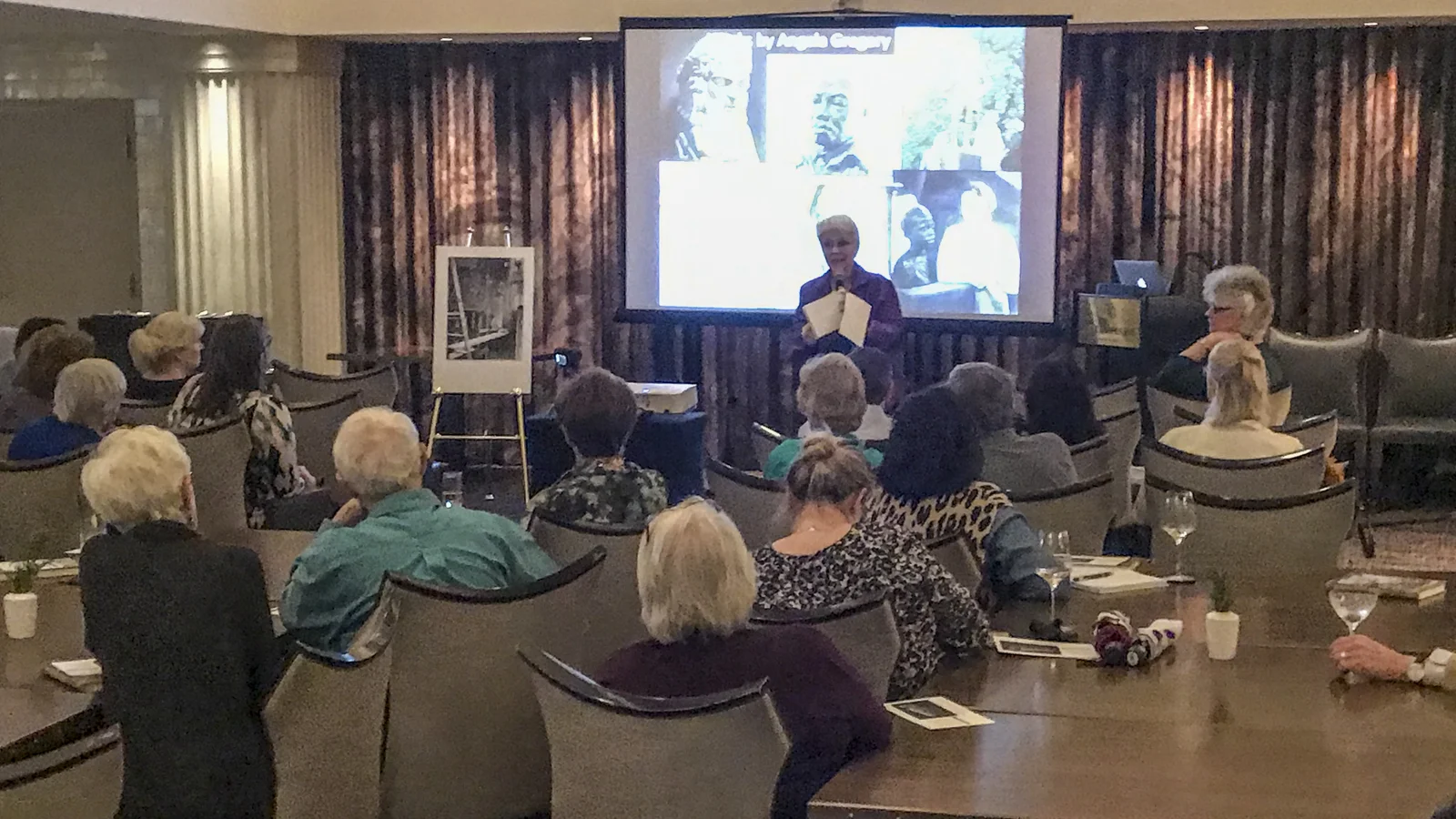 Susan Hymel, Angela Gregory historian, speaks in The Gregory restaurant, Watermark Hotel, Baton Rouge, at the launch of A Dream and a Chisel , 7 February 2019. 