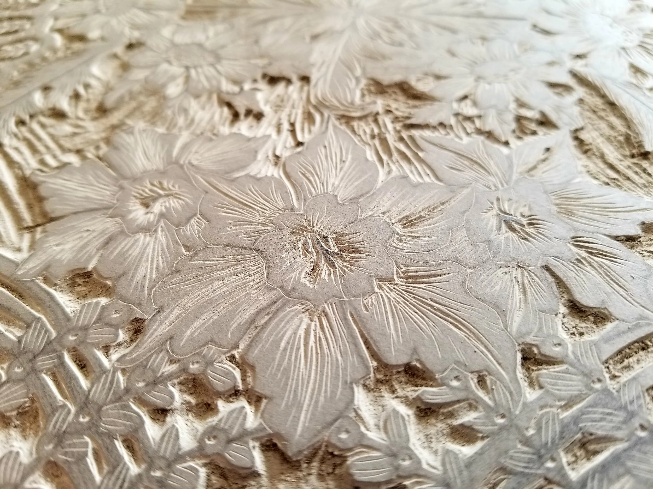 A carved linoleum block, before it is inked-up and used for printing.