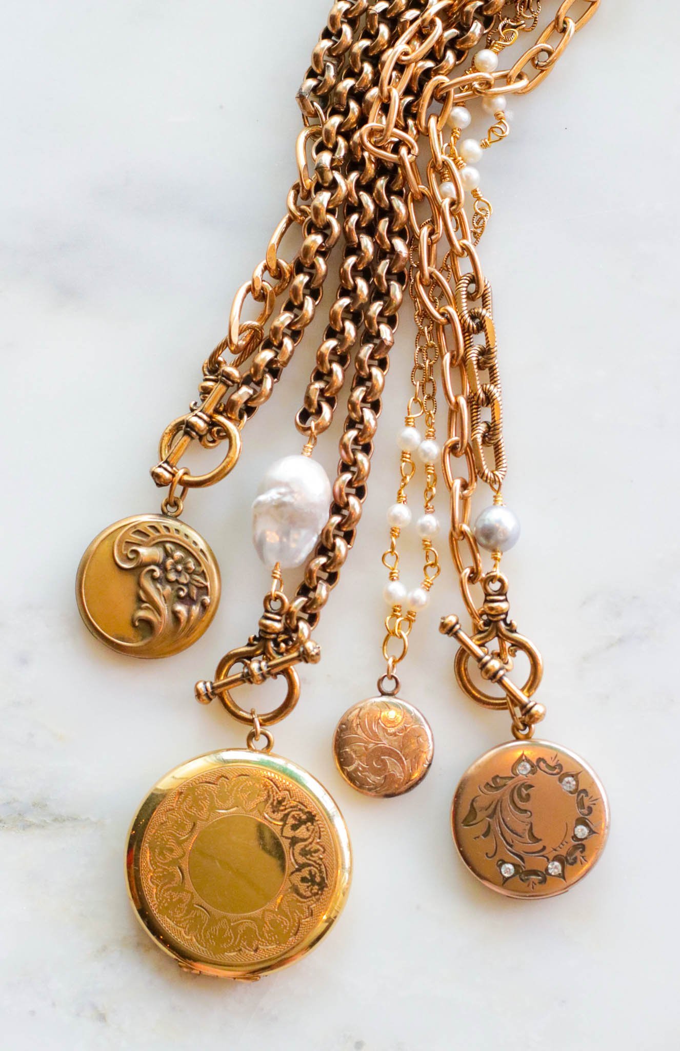 exvoto+jewelry+vintage+antique+lockets+with+gold+chains.jpeg