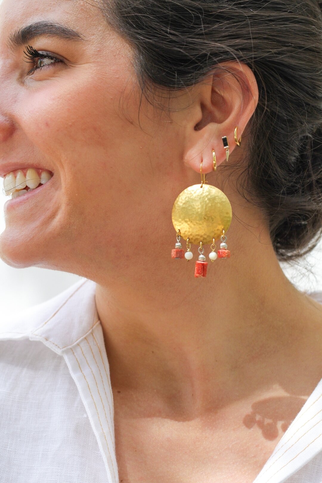 Meet the new Rosie Earring created from vintage elements of brass, coral and mother of pearl. A lightweight statement earring with a movement that makes it fun to wear!

Vintage elements given a new story