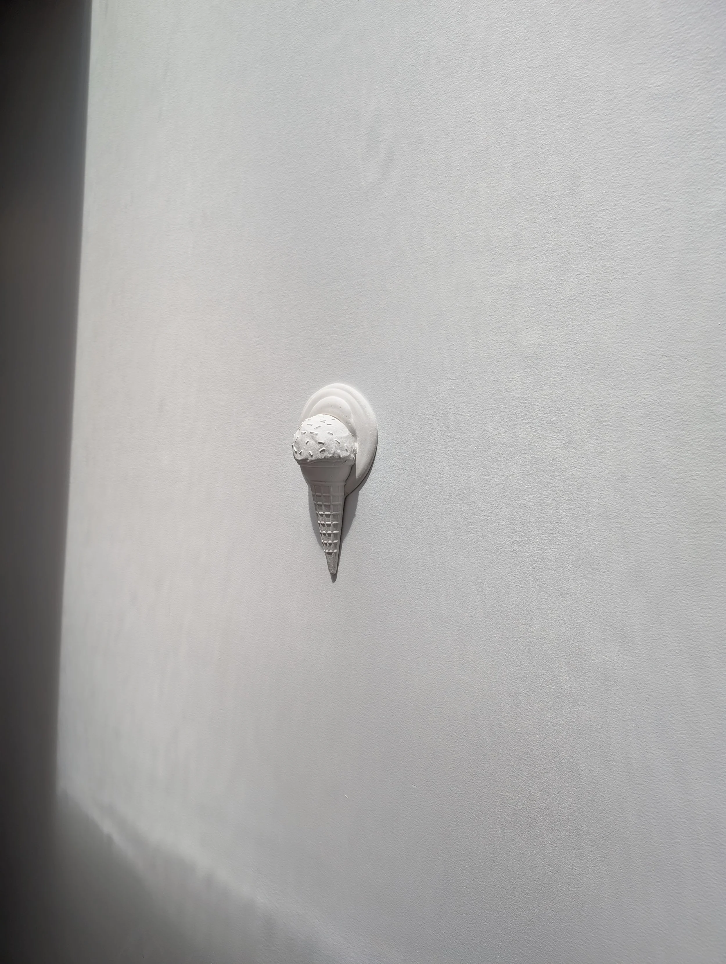 Minimalist white wall sculpture by Canadian artist Lindsay Cohen