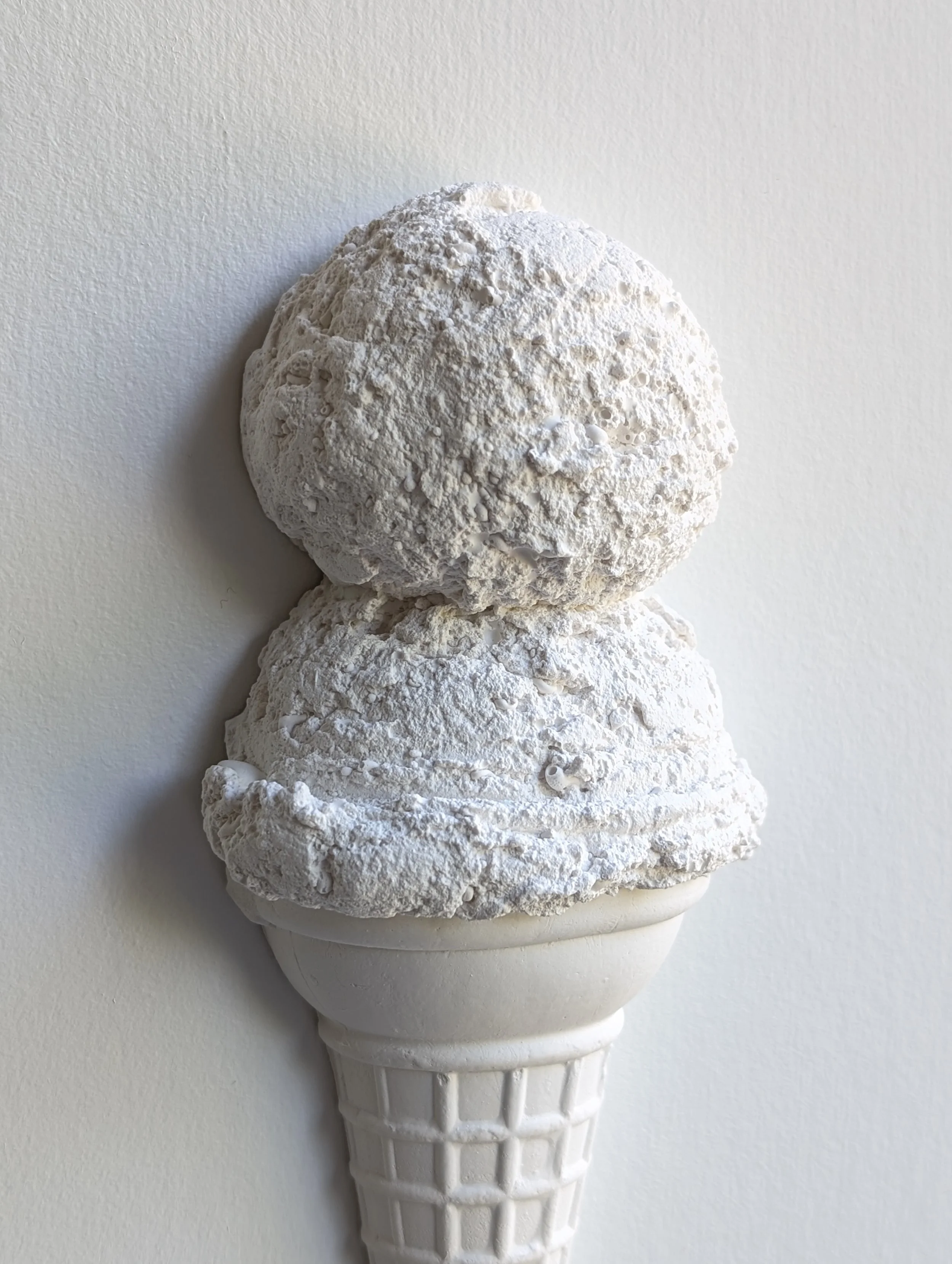 Highlights and shadows of plaster texture on an ice cream sculpture created by artist Lindsay Cohen in Vancouver, Canada