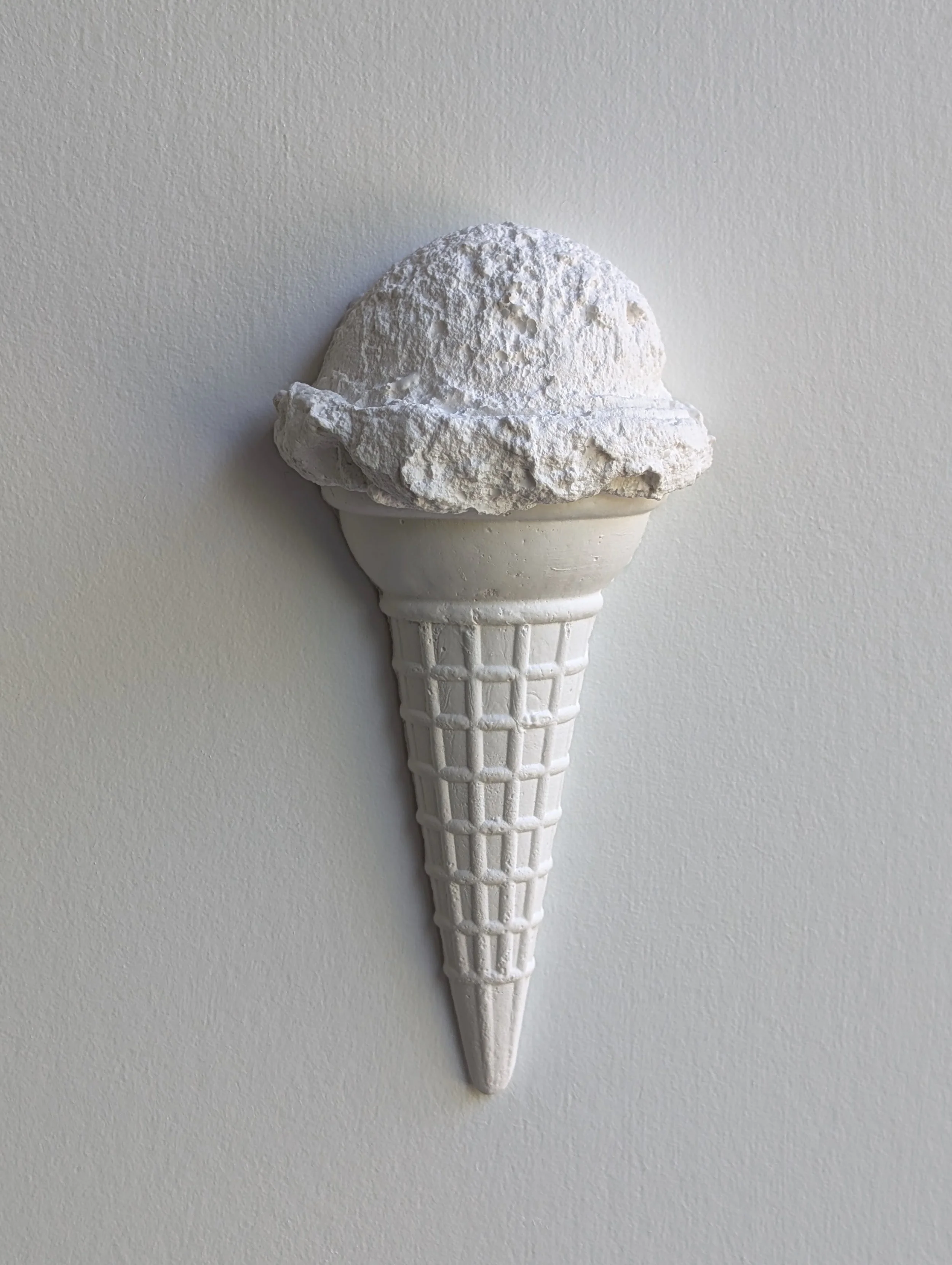 Wall-mounted ice cream sculpture made of hydrocal plaster. Artwork created in Vancouver, Canada, by Lindsay Cohen.