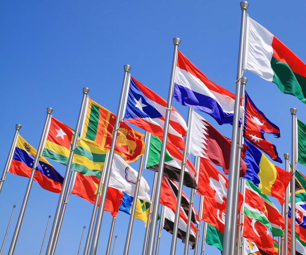 World-flags-on-poles-waving-in-the-sky-134021043_1060x990.jpeg