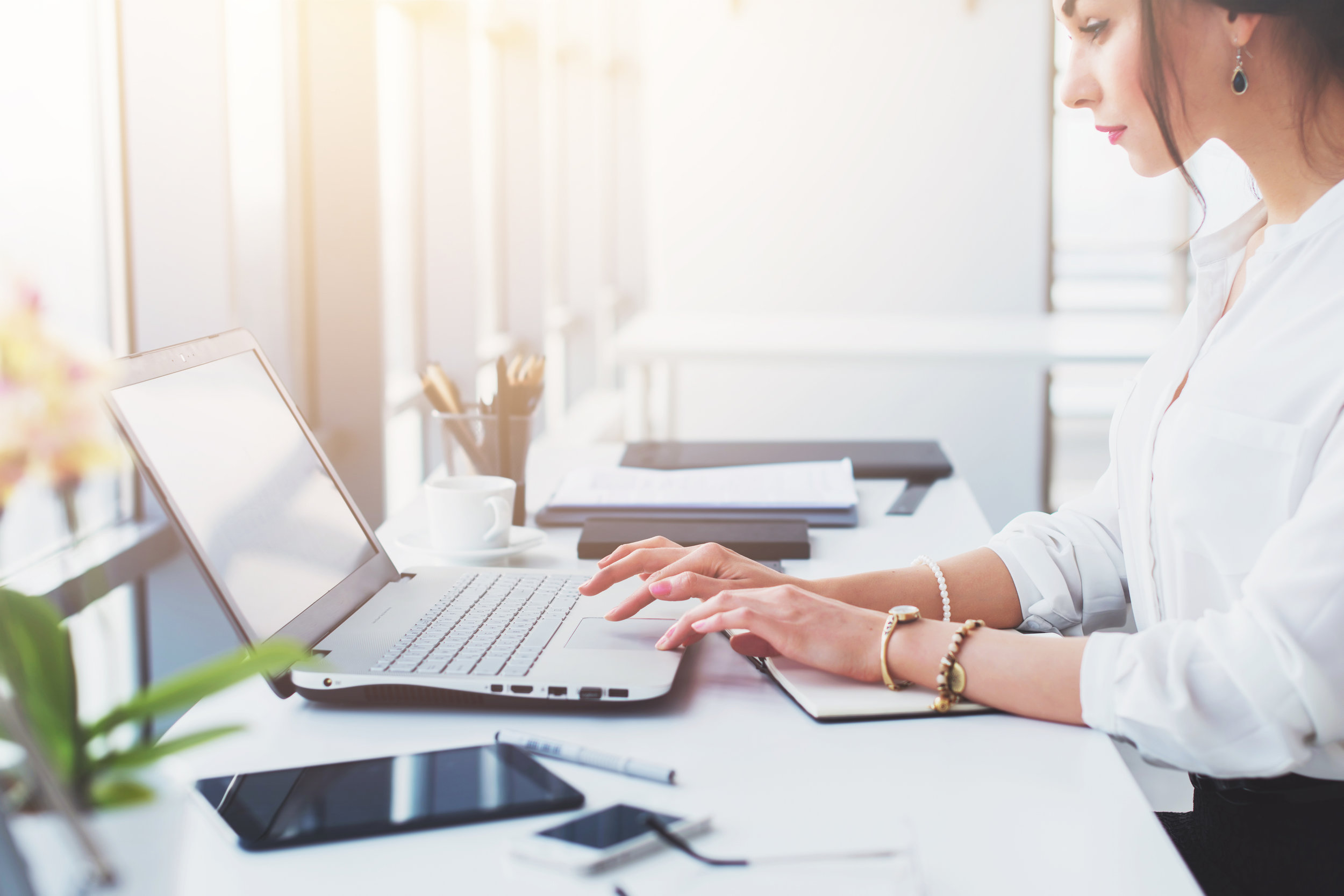 Attractive-female-assistant-working,-typing,-using-portable-computer,-concentrated,-looking-at-the-monitor.-Office-worker-reading-business-e-mail.-903030642_3866x2580.jpeg