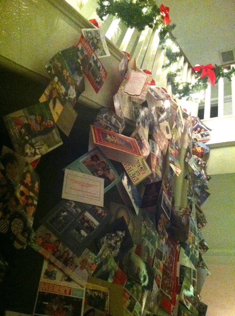 One of our family traditions: hanging Christmas cards we receive on thick ribbon along the staircase. All cards are prayed for over dinner by the family before we hang them up.