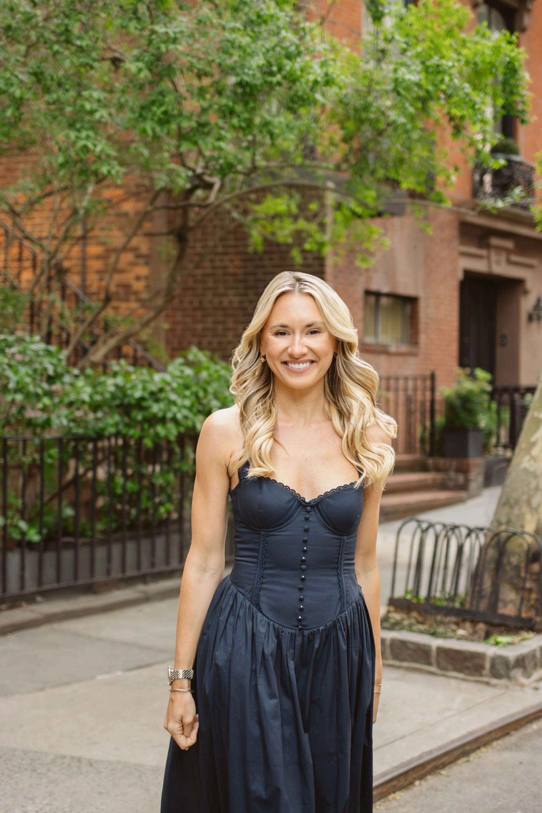 Lauren Larking stands outside NYC apartment