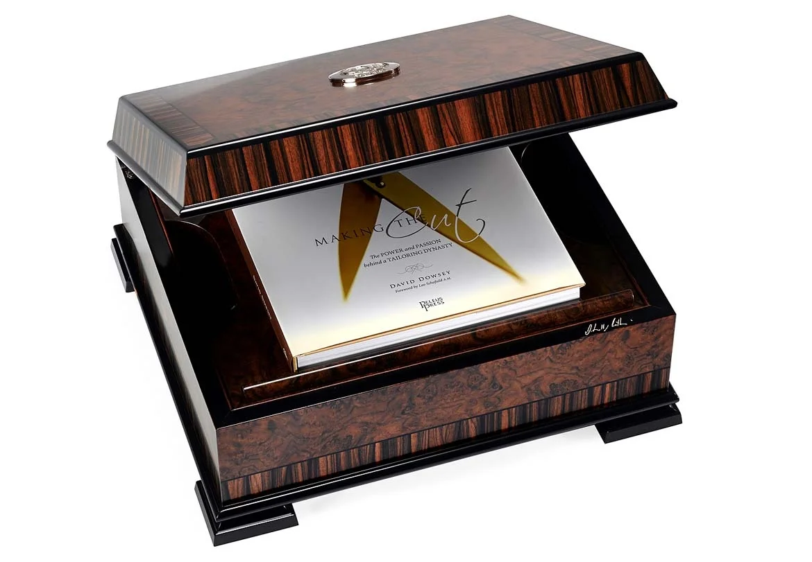 The exquisite Boucher & Co Macassar and ebony presentation box custom-made for Making the Cut: The Power and Passion behind a Tailoring Dynasty . Photo by Richard Weinstein .