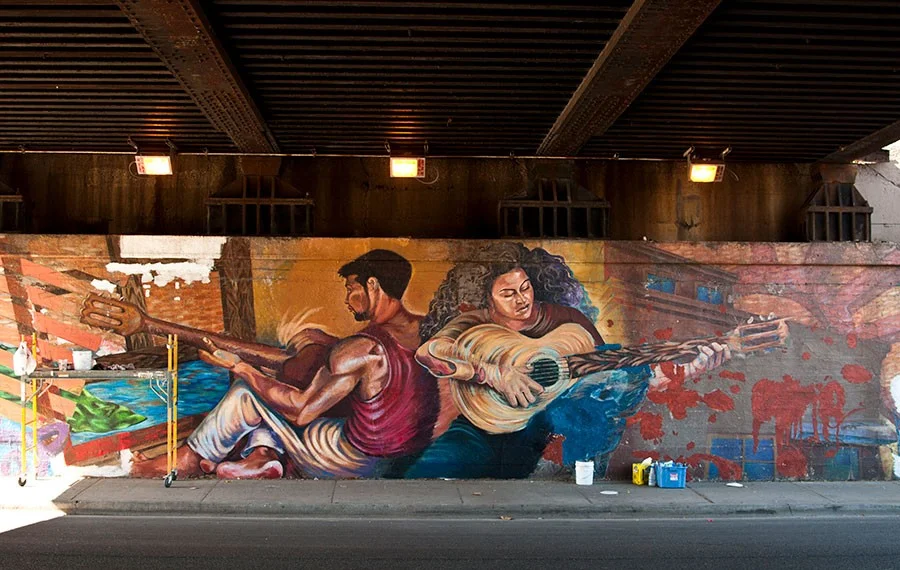  Mural photo by Scott Thompson (2010), whitewashed photo by Lee Helmer (2018). " Es Tiempo de Recordar" by a rtists Sandra Antongiorgi and Marcus Akinlana (currently of New Orleans). 