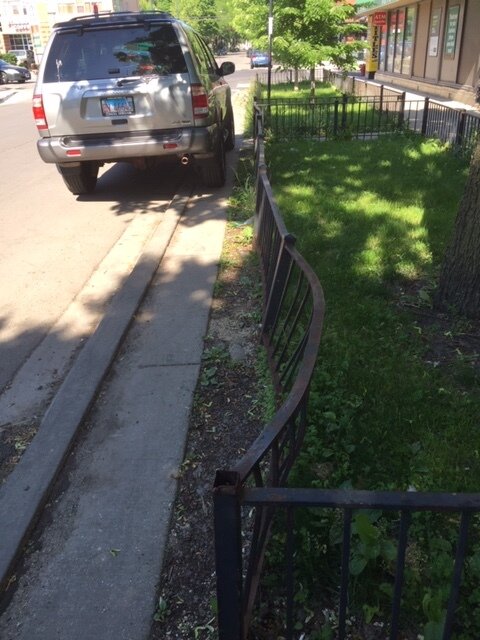 Wilson Ave example shows fence damage. Photo by Rupert Medina
