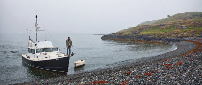 Raven’s shallow draft and workboat sensibilities make for easy access at Brimstone Island’s crescent-shaped beach of smooth stones. Photo by Rick Krementz