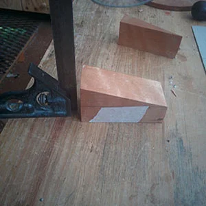 6. One of the off-cuts can be taped back on to the wedge so that the wedge centreline is parallel to the bandsaw table
