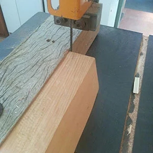 11. A block of quarter-sawn western red cedar is sawn into strips 1.0mm thick