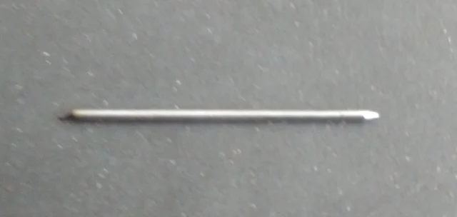 The pin is made from spring steel. The diameters used have ranged from 0.8 mm to 1.5 mm, with 1.2 mm being the preferred size. Spring steel wire is readily available from hobby shops that supply makers of model aircraft. Sewing needles are also a ready source of spring steel wire. One end of the pin needs to be ground to a sharp point.