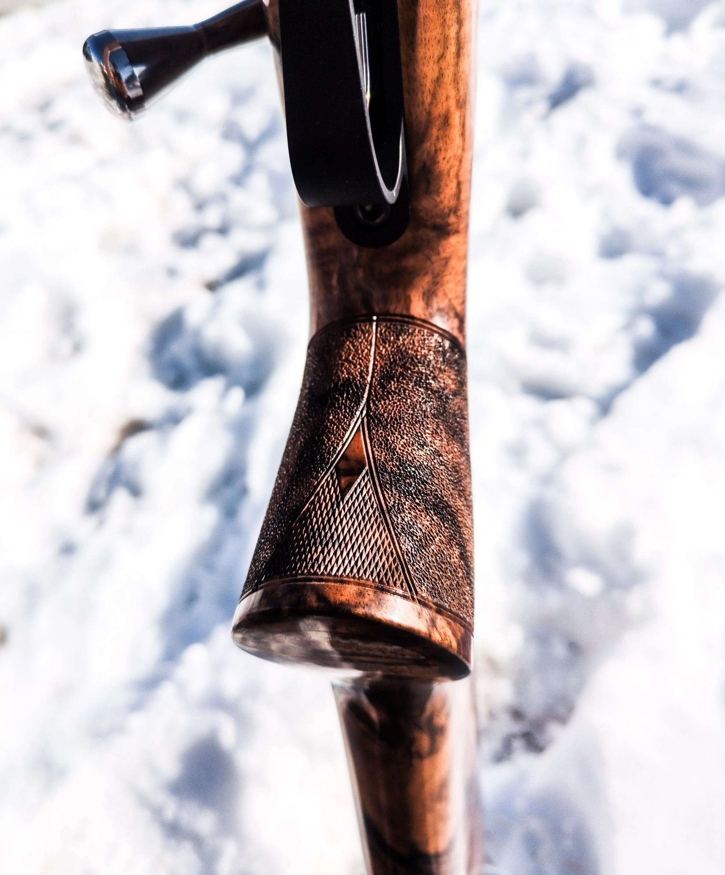 Stippled grip with checkered accent panels and border