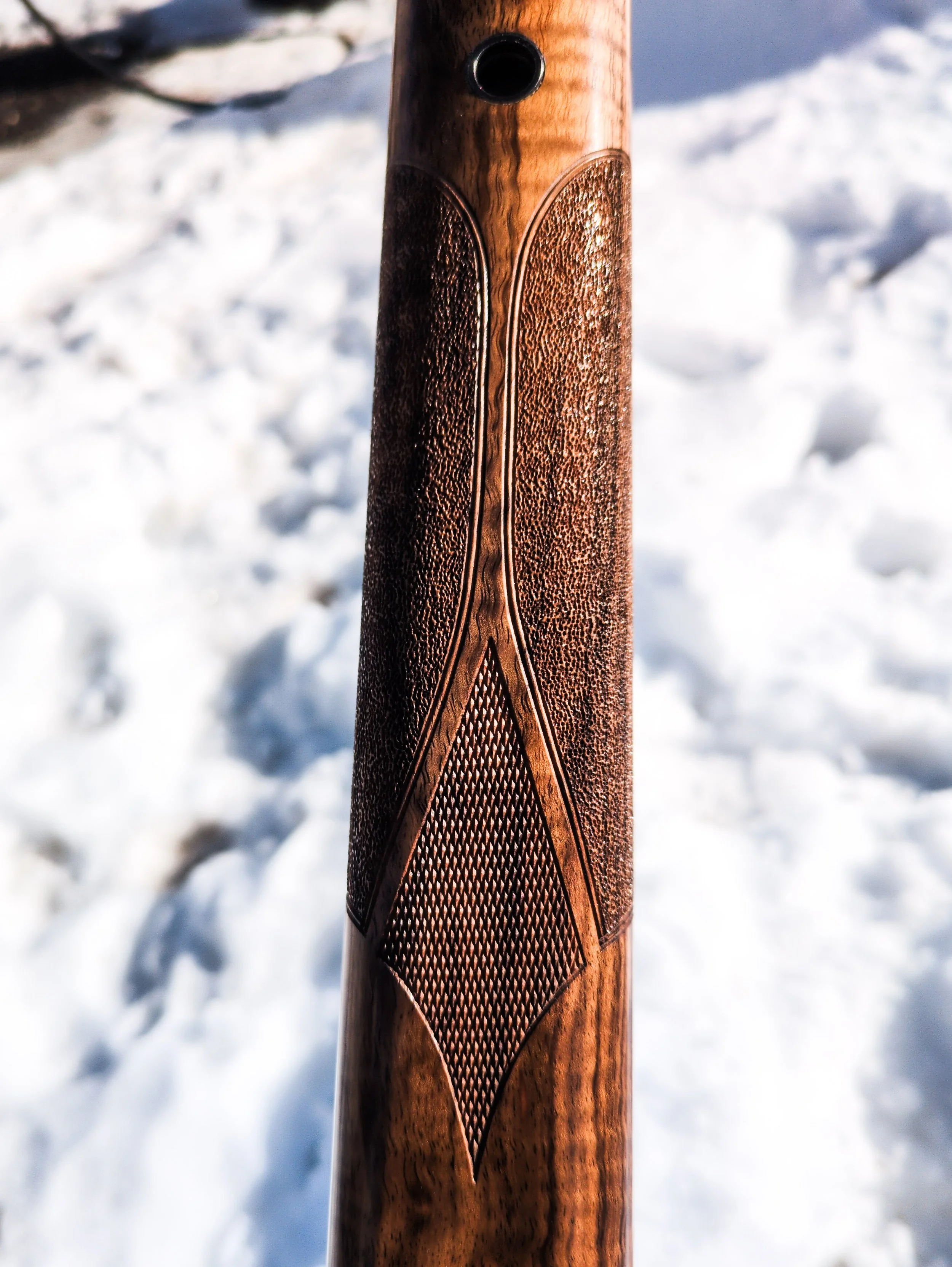 Stippled forend with checkered accent panel and border