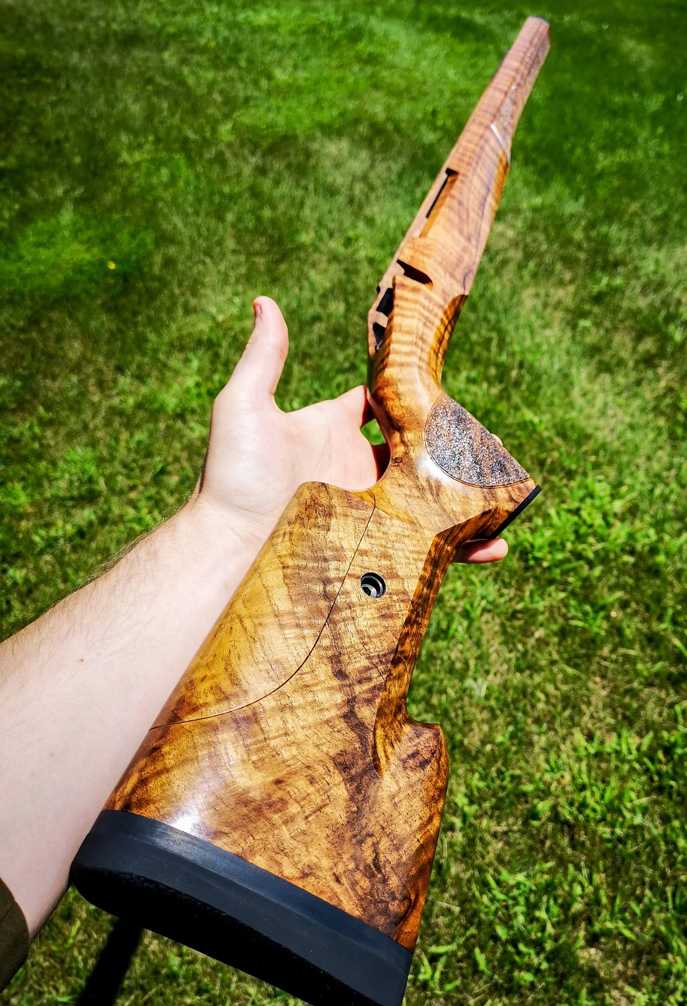 Turkish walnut stock with adjustable comb and stippled panels