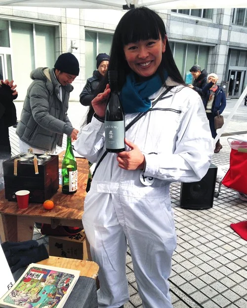 Did you know that Japan has a Miss Sake? They do! This is her — Mai Morita. She travels the world as an ambassador of Japanese sake. Love it. A lot of the organizers and VIP participants wore these white F3 lab suits. So stylish and fun.