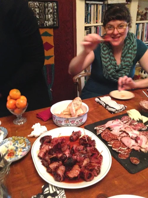 Loly with one of Tom’s yummmmmy Bacon-Wrapped Dates.