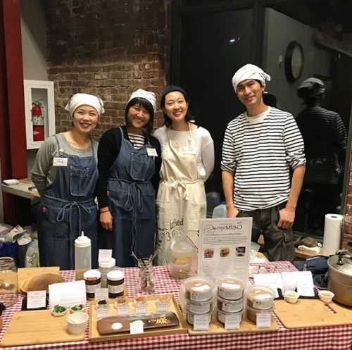We tried to make it to the Jorinji Miso table with all of these fine folks including Earnest and Yuri Migaki but they were too popular and their table was too crowded. Earnest and Yuri are my dear friends and I love them and their miso so much! If you haven't tried it before get some! Photo by Loly Leblanc.