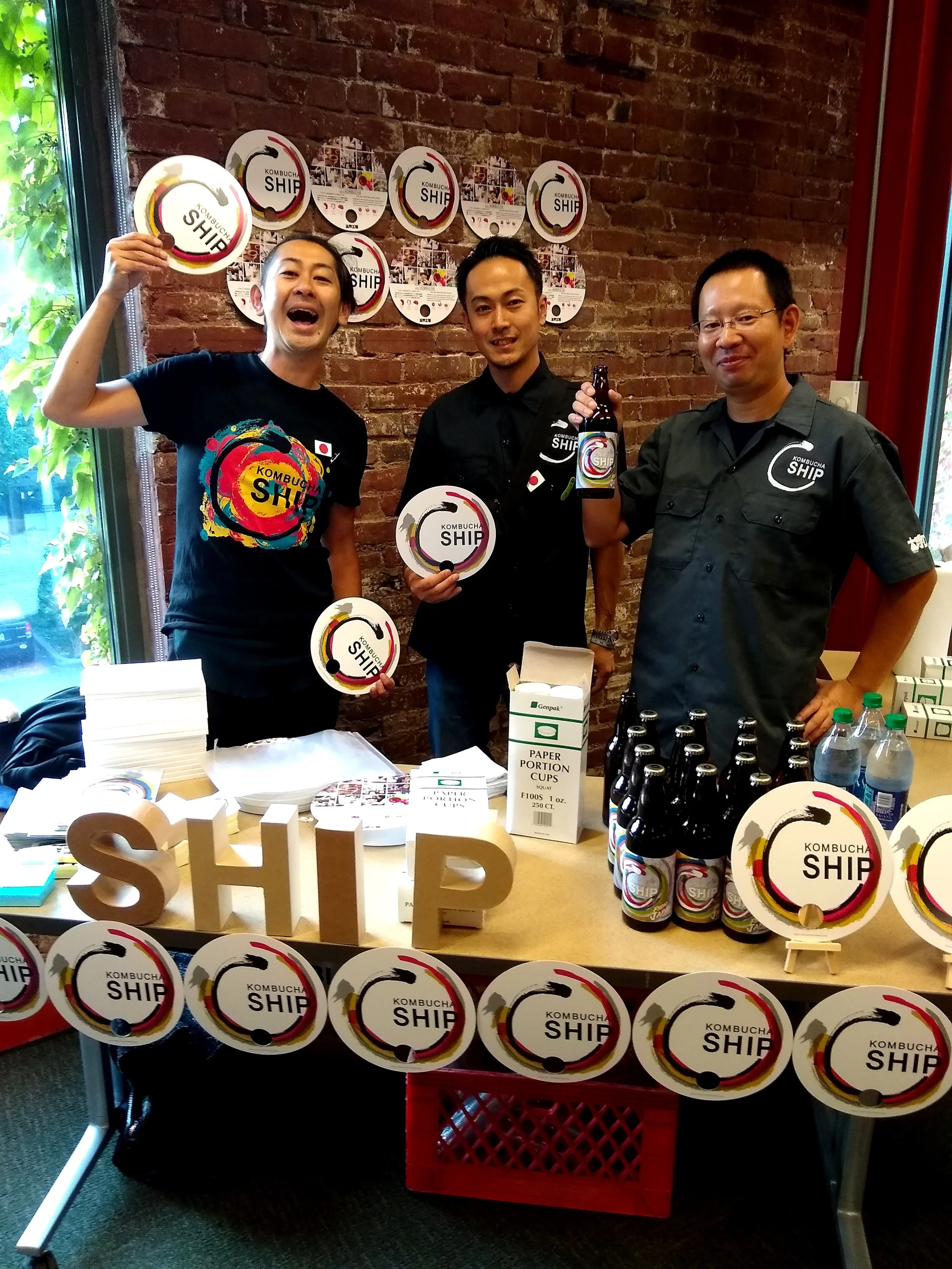 The Kombucha Ship crew having an excelent time serving up their delicious yuzu and original kombucha that they brought with them on the plane all the way from Tokyo! Only one bottle broke! They stored their kombucha at Reverend Nat’s Hard Cidery, which they love, and Nat brought it to the festival for them.