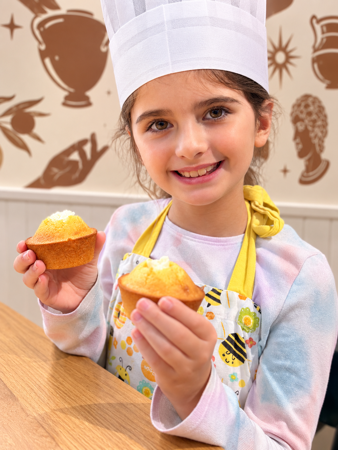 Baker with Fresh Muffins.png